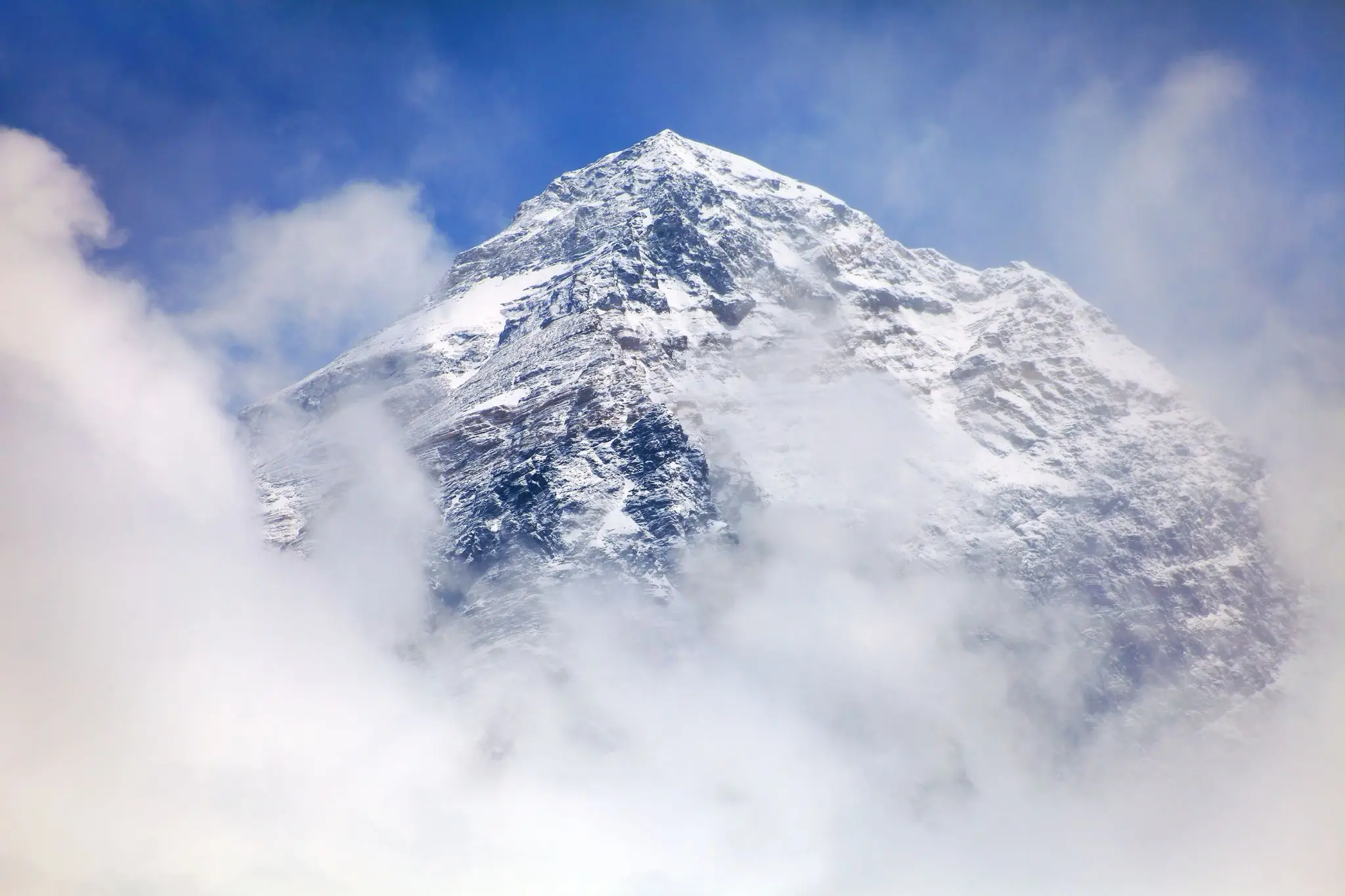 Cloudy mountain top with snowcap